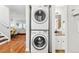 Convenient laundry area with stacked washer and dryer, plus bathroom access, is an excellent space-saving feature at 2645 S Xanadu Way # C, Aurora, CO 80014