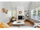 Inviting living room featuring a stone fireplace and views of the yard at 2645 S Xanadu Way # C, Aurora, CO 80014