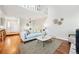 Bright living room featuring an overhead loft and hardwood floors at 2645 S Xanadu Way # C, Aurora, CO 80014