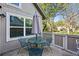 Outdoor patio with umbrella, seating, and grill area with view of backyard at 2645 S Xanadu Way # C, Aurora, CO 80014