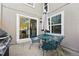 Back patio seating area with easy access to the kitchen via sliding glass door at 2645 S Xanadu Way # C, Aurora, CO 80014