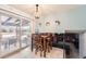 Dining room with table, a chandelier, and sliding glass door to the outside patio at 15341 E Arkansas Pl, Aurora, CO 80017