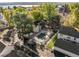 Aerial view of the community pool, mature trees, and beautiful landscaping in a Gathering-friendly neighborhood at 5374 W Canyon Trl # B, Littleton, CO 80128