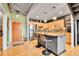 Modern kitchen with stainless steel appliances, a center island, and wooden cabinets at 1860 N Washington St # 212, Denver, CO 80203