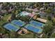 Aerial view of community recreation area featuring tennis courts, swimming pool, and clubhouse at 7844 S Eudora Cir, Centennial, CO 80122