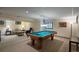 Finished basement featuring a pool table, seating area, and neutral decor for entertainment at 7844 S Eudora Cir, Centennial, CO 80122