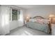 Bright bedroom with large windows, a cozy bed, and neutral tones for a relaxing atmosphere at 7844 S Eudora Cir, Centennial, CO 80122