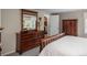 Primary bedroom with a large closet, wood furniture, and a view to the outside at 7844 S Eudora Cir, Centennial, CO 80122