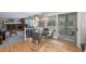 Dining room leading to a backyard patio and a fireplace with built in shelves at 7844 S Eudora Cir, Centennial, CO 80122