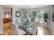 Elegant dining room with a glass table, chandelier, and views of the private backyard at 7844 S Eudora Cir, Centennial, CO 80122