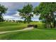 Scenic view of golf course with a small bridge and walking path surrounded by lush greenery at 7844 S Eudora Cir, Centennial, CO 80122