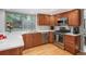 This updated kitchen features stainless appliances, ample cabinet space and a window overlooking lush greenery at 7844 S Eudora Cir, Centennial, CO 80122