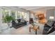 Open concept living room and kitchen features a fireplace and great light at 7844 S Eudora Cir, Centennial, CO 80122