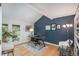 Cozy office with hardwood floors, built-in shelves, vaulted ceilings, and large windows at 7844 S Eudora Cir, Centennial, CO 80122