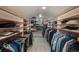 Well-organized walk-in closet featuring custom shelving for clothes, shoes, and accessories at 7844 S Eudora Cir, Centennial, CO 80122