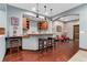 Basement bar area with wood countertop, cabinets, dark wood flooring, and two stools at 3048 Starling Ct, Castle Rock, CO 80109