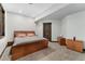 Bedroom with a wood bed frame, wood trim, and neutral gray carpet at 3048 Starling Ct, Castle Rock, CO 80109