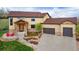 Stunning two-story home with a stone facade, well-maintained landscaping, and a three-car garage, offering curb appeal and convenience at 3048 Starling Ct, Castle Rock, CO 80109