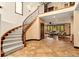 Elegant foyer with a grand staircase, iron railings, high ceilings, and an open view to the living room, creating a welcoming ambiance at 3048 Starling Ct, Castle Rock, CO 80109