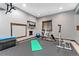 Home gym with workout equipment and a mounted television at 3048 Starling Ct, Castle Rock, CO 80109