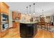 Spacious kitchen island with granite countertops, pendant lighting, and seating, perfect for entertaining and casual dining at 3048 Starling Ct, Castle Rock, CO 80109