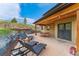 Relaxing outdoor patio area with lounge chairs, dining table, and fire pit perfect for entertaining or enjoying nature at 3048 Starling Ct, Castle Rock, CO 80109