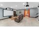 Home theater room with a projector, big screen, and comfortable seating at 3048 Starling Ct, Castle Rock, CO 80109