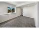 Bedroom with large window offers ample natural light and has neutral decor at 11933 W 83Rd Ln, Arvada, CO 80005