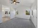 A primary bedroom with vaulted ceiling, skylight, and ensuite bathroom at 11933 W 83Rd Ln, Arvada, CO 80005