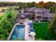 Breathtaking aerial view of a luxurious property featuring a pool, spa, and beautifully landscaped grounds at 5 Random Rd, Cherry Hills Village, CO 80113