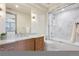 Bathroom with a double vanity, a shower/tub combo, and marble countertops at 5 Random Rd, Cherry Hills Village, CO 80113
