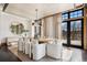 Bright dining room with large windows, modern lighting, a large dining table and beautiful view of the outdoors at 5 Random Rd, Cherry Hills Village, CO 80113