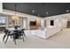 Spacious living room with a modern black ceiling, ample seating, and large windows for natural light at 5 Random Rd, Cherry Hills Village, CO 80113
