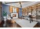 Stylish home office with custom shelving, a fireplace, and contemporary decor at 5 Random Rd, Cherry Hills Village, CO 80113