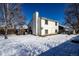 House exterior and backyard with snow and shed at 1621 Flemming Dr, Longmont, CO 80501