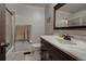 Clean bathroom with a vanity, bathtub, and marble countertop at 1621 Flemming Dr, Longmont, CO 80501