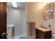 Clean bathroom with a vanity, shower, and laundry appliances at 1621 Flemming Dr, Longmont, CO 80501