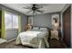 Bright bedroom with a ceiling fan, double bed, and mirrored dressers at 1621 Flemming Dr, Longmont, CO 80501