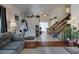 Living room with hardwood floors, and view of kitchen at 1621 Flemming Dr, Longmont, CO 80501