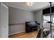 Bright music room with piano, storage and hardwood floors at 1621 Flemming Dr, Longmont, CO 80501