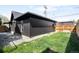 Backyard featuring fresh grass and a modern home design at 754 S York St, Denver, CO 80209