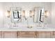 Elegant bathroom with double sinks, marble countertops, designer fixtures, and warm lighting at 754 S York St, Denver, CO 80209