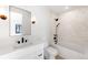 Bright bathroom with modern fixtures, sleek tub, and contemporary design at 754 S York St, Denver, CO 80209