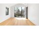 Airy bedroom with hardwood floors and large windows offering natural light and pleasant views at 754 S York St, Denver, CO 80209