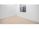 Clean and simple bedroom features neutral carpet and minimalist design at 754 S York St, Denver, CO 80209