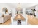 Bright, open dining room with long table and chairs, flowing into kitchen and living space at 754 S York St, Denver, CO 80209