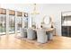 Elegant dining area with large windows, stylish chandelier, and hardwood floors at 754 S York St, Denver, CO 80209
