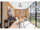Bright home office with wood paneled walls, stylish decor, modern lighting and large windows offering plenty of sunlight at 754 S York St, Denver, CO 80209