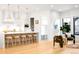 Open floor plan with kitchen island, bar stools, and adjoining seating area at 754 S York St, Denver, CO 80209