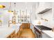 Modern kitchen featuring stainless steel appliances, white countertops, and wooden cabinets at 754 S York St, Denver, CO 80209